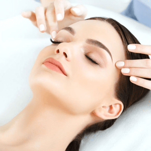 woman having a temple massage for Elements Medical